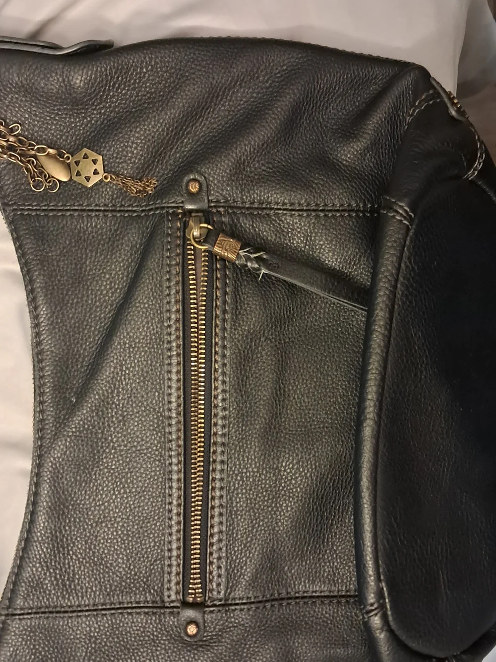 The Sak Black Pebbled Leather Hobo with Antique-Gold Hardware